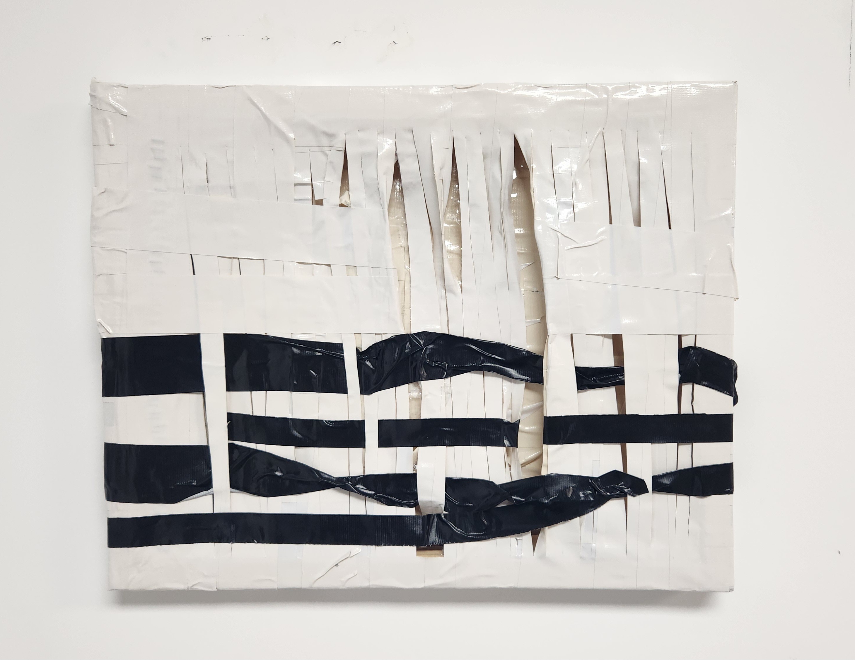 Mixed media artwork with white and black strips, some torn and layered, on a white background.